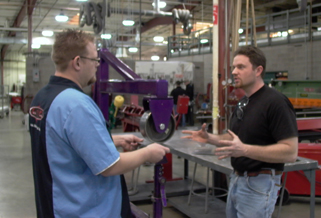 Pat Woods with a Wyotech instructor discussing the wheel